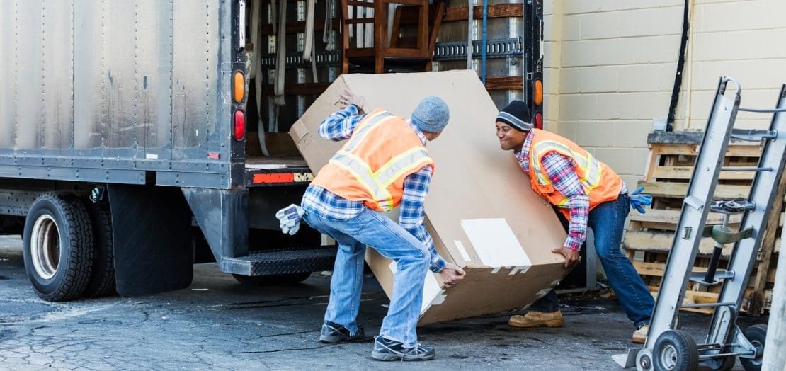Two suppliers unloading truck